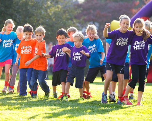 This is a cover image shows a group of children wearing T-shirts with “field day” printed on them.