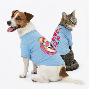 Dog and cat wearing matching blue t-shirts with a colorful design on a white background