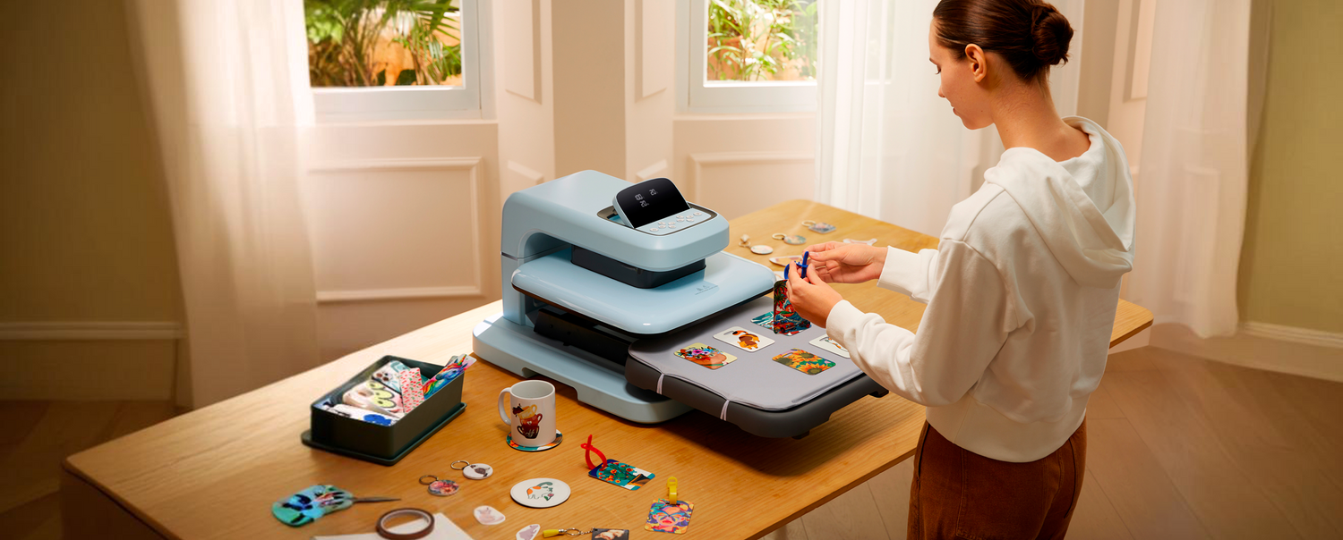 Woman using a Auto hest press machine at a table with various supplies.